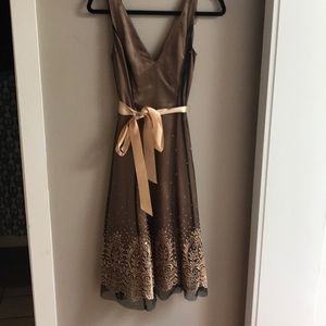 Gold dress with black overlay.